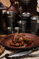 Fried chicken wings in honey sauce.