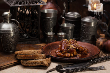 Fried chicken wings in honey sauce.