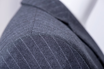 details on the  pinstripe suit coat
