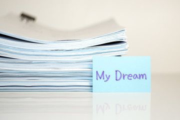 My Dream; Stack of Documents on white desk and Background.