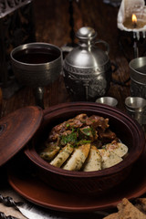 roast potatoes with meat in pot
