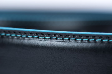Details on black classic belt with blue line