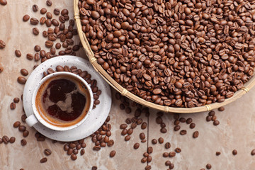 Cup of black coffee and  beans
