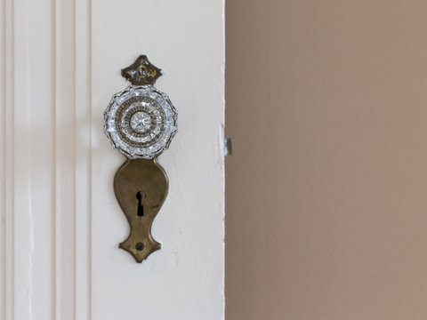 antique crystal doorknob on white foor