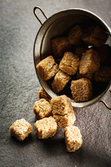 Brown organic sugar cubes close-up