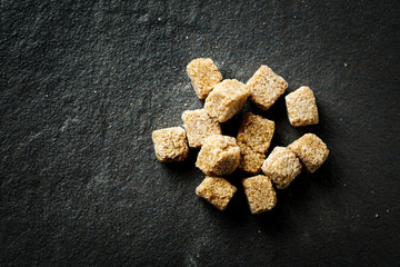 Brown organic sugar cubes close-up