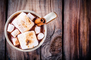 hot chocolate with marshmallows and cinnamon in mug