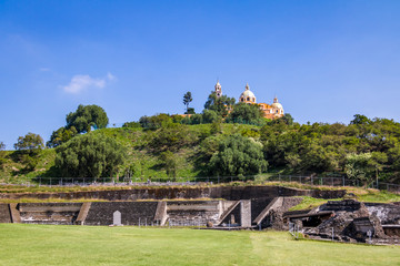 Ruins of Cholula pyramid with Church of Our Lady of Remedies at top of it - Cholula, Puebla, Mexico