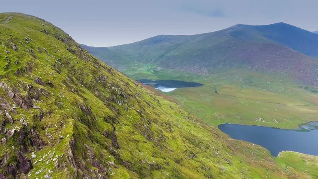 The aerial view from the SkyRoad in Ireland the big volcano and the clouds in the landscape view