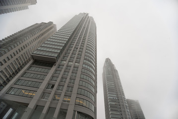 Downtown skyscrapers under the fog upward view at the Puerto Madero.