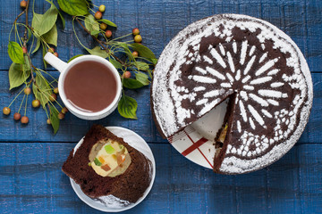 Chocolate cake with whole apples, curd and candied fruit