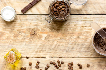 Body scrub of ground coffee top view on wooden table