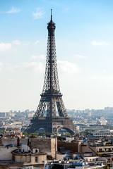 Naklejka premium Parisian cityscape with Eiffel tower and rooftops