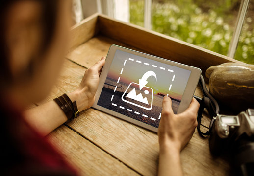 User with Tablet by Window Mockup