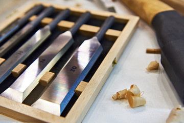 Steel blades many chisels and sawdust chippings