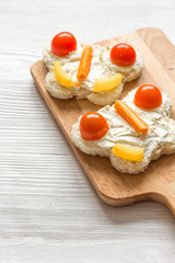 cooking shaped sandwiches for children on wooden background