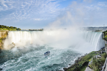 Fototapeta na wymiar Ship in front of Horseshoe Fall, Niagara Falls, Ontario, Canada