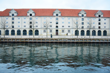 Beautiful building and reflection in water near by ocean in copenhagen in Danemark