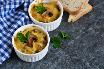 Baked chicken with mushrooms in a cream sauce with cheese