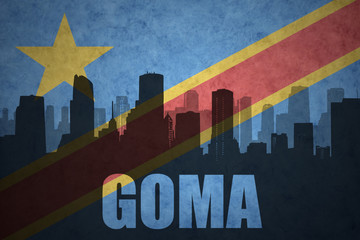 abstract silhouette of the city with text Goma at the vintage democratic republic of the congo flag