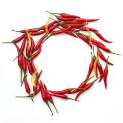 Red hot peppers with flames in a circle on white background