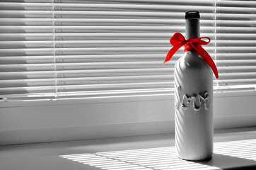 Bottle with tittle LOVE and with red ribbon