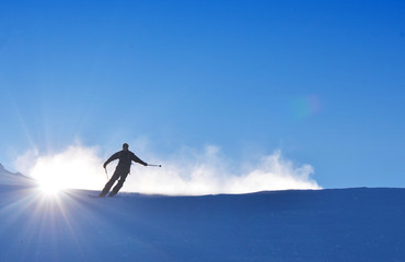 Man on ski is skiing on the snow during wonderful sunny day, best for winter extreme sports
