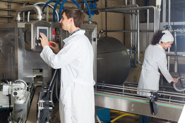 Fototapeta premium ﻿man and woman working on factory