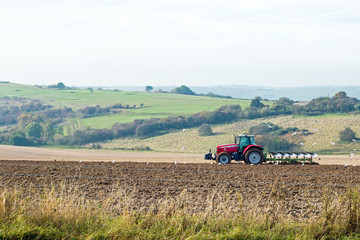 Fototapeta premium Tractor Ploughing Field