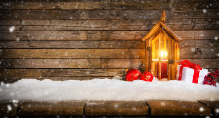 Christmas background with gifts and lantern