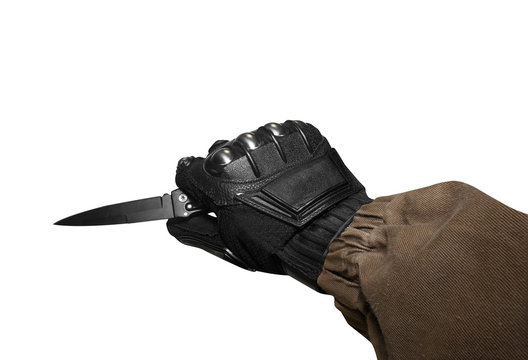 Isolated first person view soldier hand in black battle gloves & tactical jacket holding knife ready for defense.