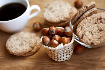 tasty cookie and cup of coffee on the wooden table