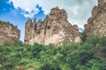 Fototapeta na wymiar View on mountain cliffs and magnificent cloudy sky on background. Exploring Armenia