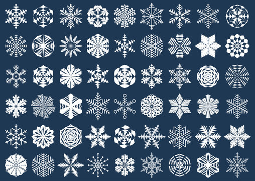 Big set of white snowflake silhouettes isolated on blue background. Winter, New Year, Christmas festive symbols