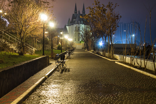 Amazing night street view with castle on background