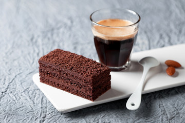 Piece of chocolate cake and coffee, selective focus