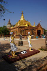 monks carrying large bell