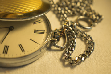 Old pocket watch in close-up view
