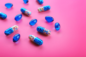 Color pills on pink background