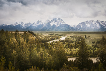 Fototapeta premium A Mountain Range and Snake River, Grand Teton National Park, USA. Landscape is unique and part of Rocky Mountain. Grand Teton National Park is also popular among landscape and nature photographer