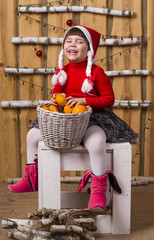 joyful girl with basket of tangerines