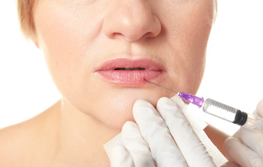 Procedure of lips augmentation with hyaluronic acid injection