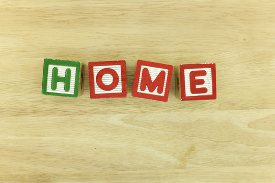 Home sign on board with alphabet cube