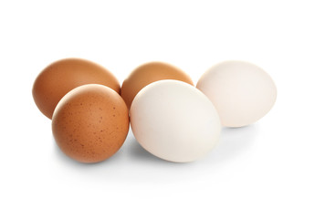 Raw eggs on white background