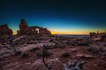 Rock Formations In Remote Desert Landscape Under Starry Night Sky - 126595319