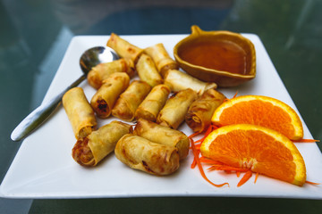 Thai food: deep-fried cabbage rolls (served with plum sauce) - 126595345