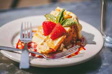 Slice of strawberry cake for two on a plate - 126595397