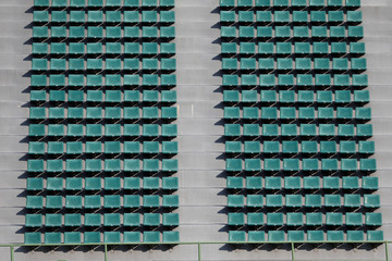 green spectator seats at a football stadium