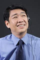 Businessman using hands free device