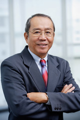 Fototapeta premium Businessman with arms crossed